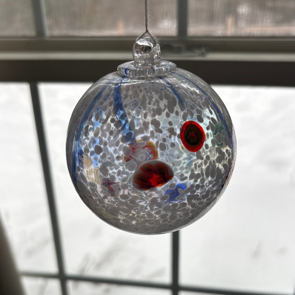 Handcrafted Blown Glass Ornament with Red and Blue Accents - Picture 2 of 4